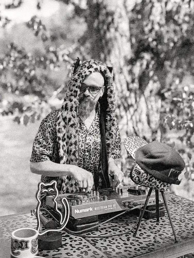 Midas the Fuzzy Cat DJing on the beach at Dunn Folkin' Around 2026, Dunn Lake, British Columbia